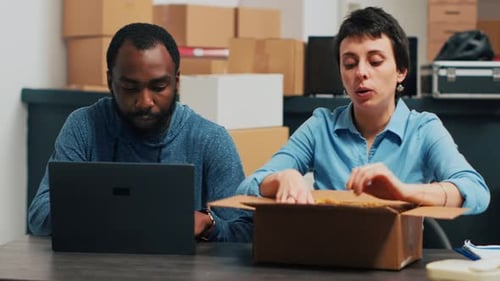 Business Owners Checking Quality of Products to Ship Order From Warehouse
