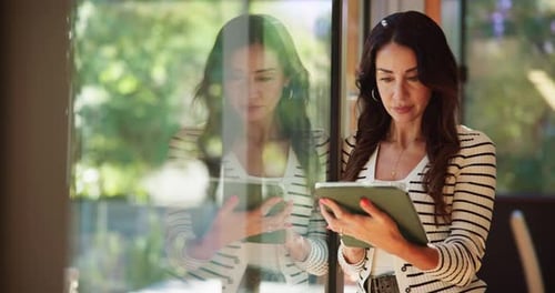 Woman, window or tablet in home to search for online blog, interior design and social media post