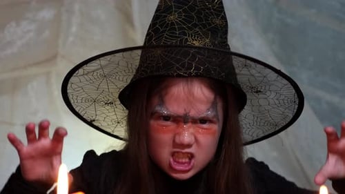 Little Girl Dressed Up as a Spooky Witch