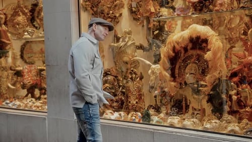 Male Tourist Enjoys Ornate Art In Venice's Shop Window