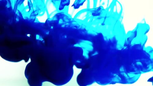Blue Ink Dissolving Abstractly on White Background