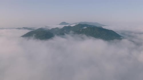 The beautiful morning view of the mist flowing on the high mountains