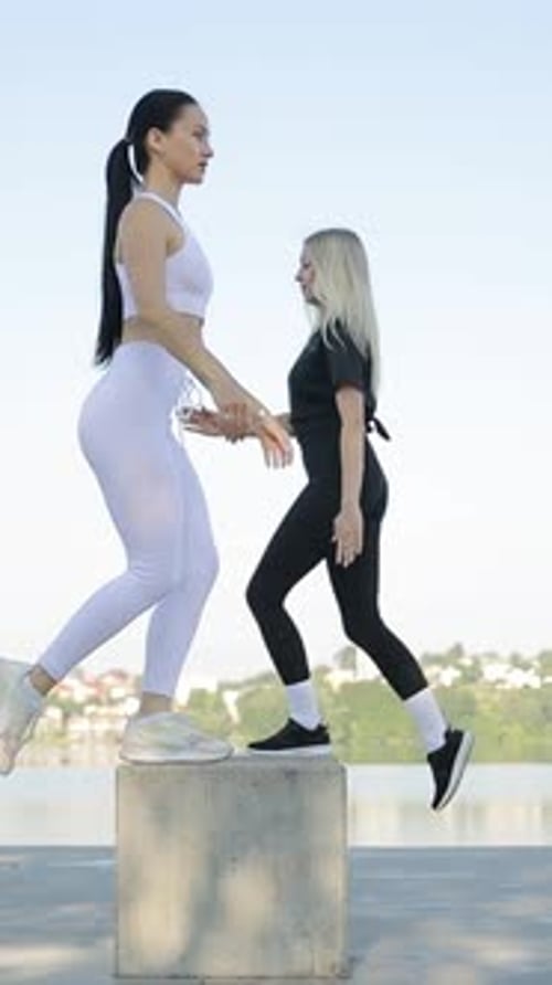 Young Positive Lady Trainer During Fitness Training Outdoors in Park Vertical Video