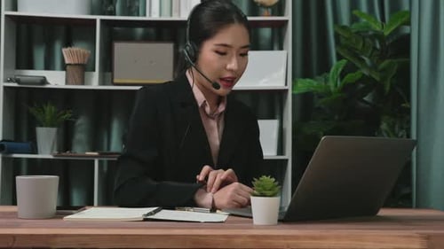 Young Woman Working from Home on Laptop