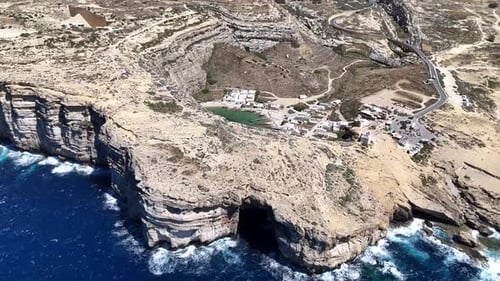 Drone footage of Dwerja Bay on Gozo Island, Malta