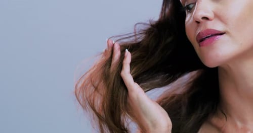 Damage, hair and hands of woman in studio for frizz treatment, growth and healthy texture