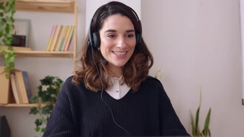 Young Adult Business Woman Working on Laptop Computer at Office