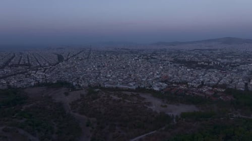 Aerial view of Acropolis at sunrise with cityscape, Greece.