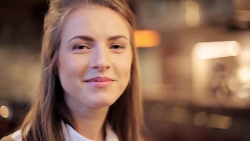 Smiling Woman Portrait in Soft Focus, Warm Light