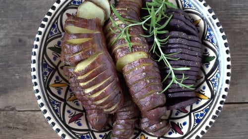 Roasted Potatoes and Rosemary in Decorative Bowl