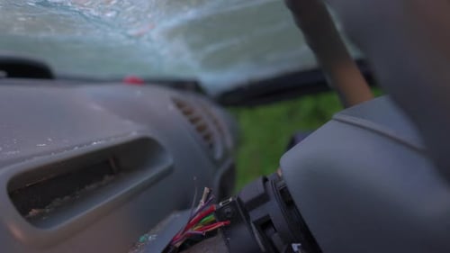 Crashed Car Interior with Broken Windshield