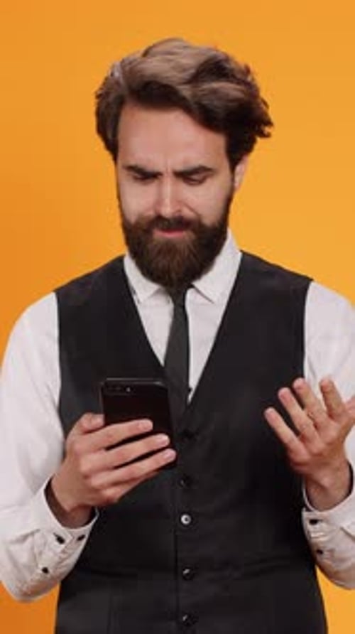 Vertical Video Professional Waiter Checking Phone