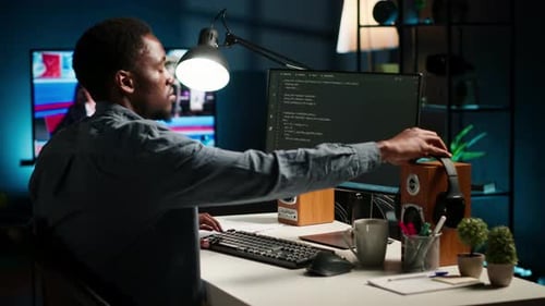 African American Male Programmer Working on Cloud Computing with an Algorithm