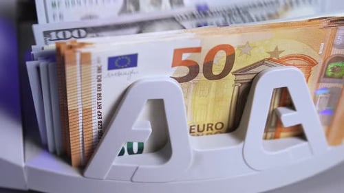 Currency Counting Machine Counts Euros and Dollars