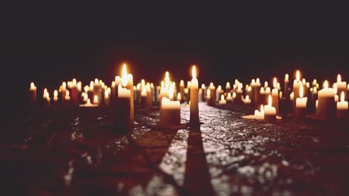 Warm Burning Candles in Dark Room