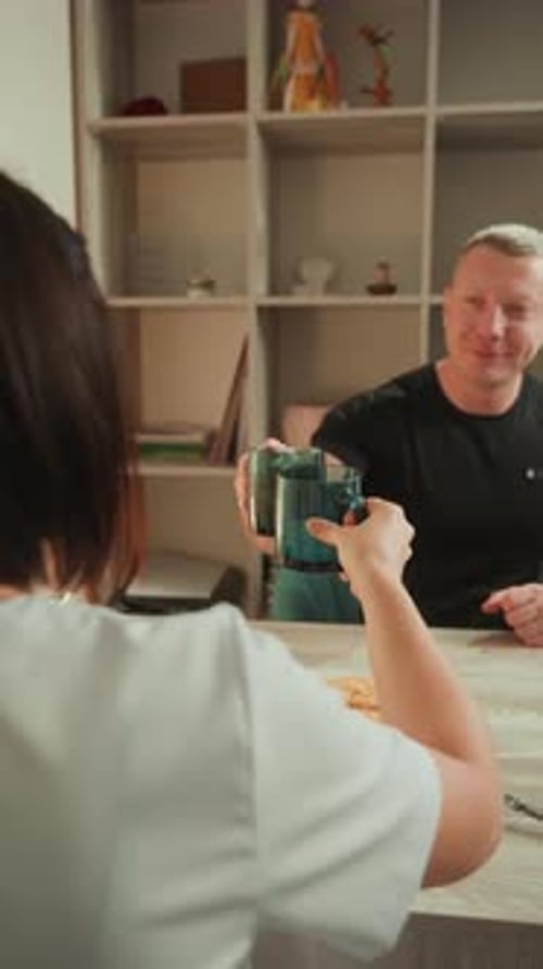 Couple Drinks Coffee and Eats Cake at Home