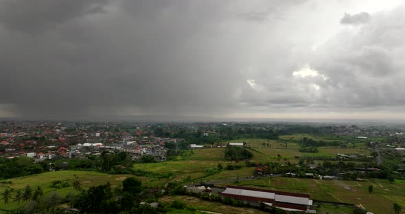 Bali rice fields in Indonesia with cloudy stormy sky. Aerial drone ...
