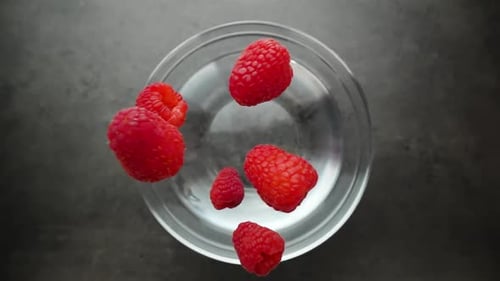 Raspberries Splashing in Water