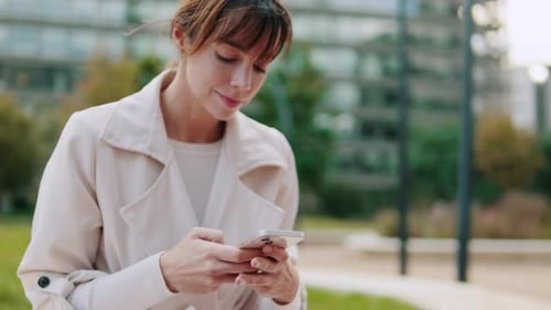 Businesswoman or pretty modern lady Using Phone in the City