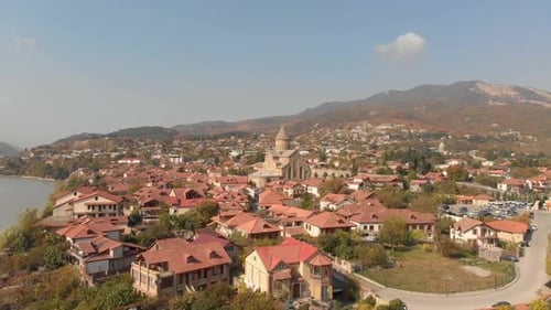 Aerial view of the Svetitskhoveli Cathedral, located in the city of Mtskheta, Georgia, with the came