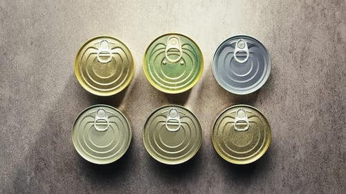 Metal Cans with Canned Food or Pate Top View Golden and Silver Cans with Pull Rings Canned Tourist