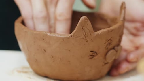 Girl Learns Pottery and Shapes the Clay in the Pottery Workshop During Masterclass