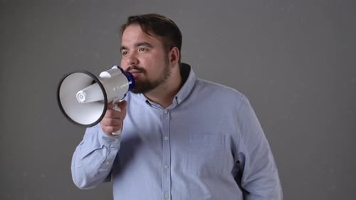 Man Making Announcement Through Megaphone