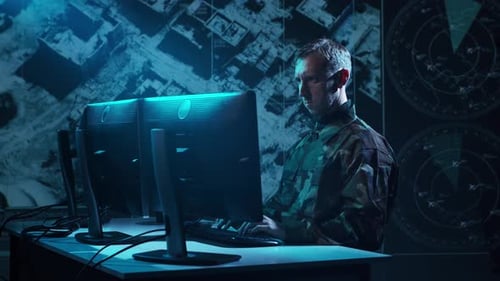Military Soldier Operating Advanced Technology in a Command Center