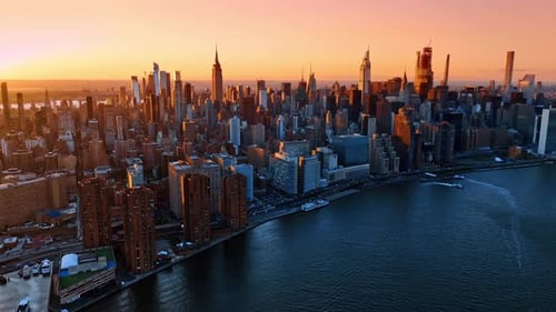Approaching the downtown of New York from drone over the East River.