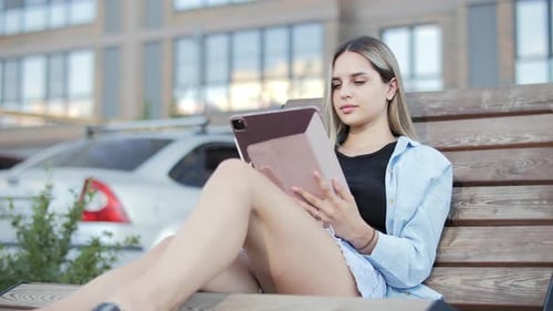Young Woman With Tablet In Urban Landscape Female Using Gadgets For Work
