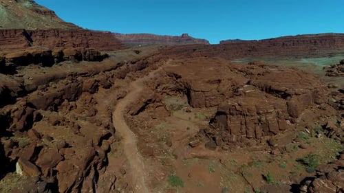 Beautiful aerial footage of canyons full of red rocks in utah