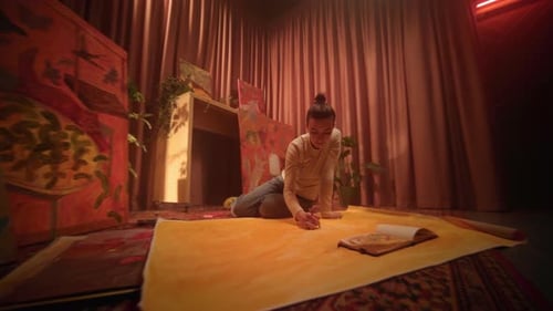 Artist Drawing on Large Paper at Home Studio