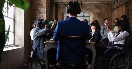 Business People Wearing Virtual Reality Goggles Inside Office