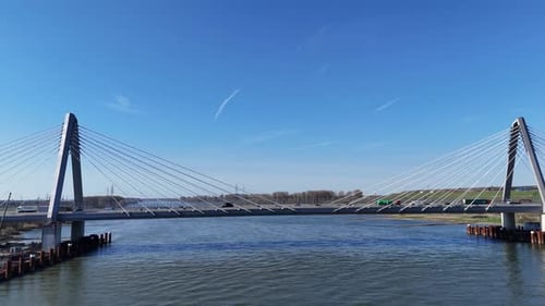 Wide river view of modern bridge under construction