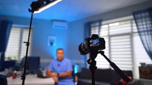 Man Recording Video in a Home Office