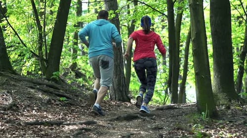 Active Couple Jogging In The Park, Forest, Super Slow Motion