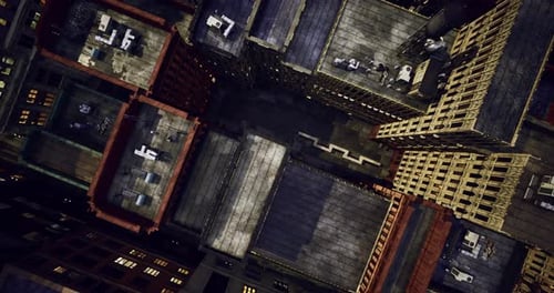 Vista aérea de edificios urbanos que muestran detalles de azoteas en el crepúsculo