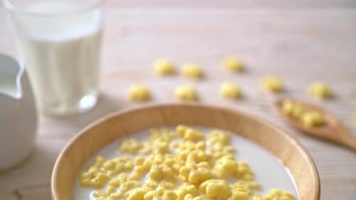 Flower Corn Flakes and Milk in Wooden Bowl