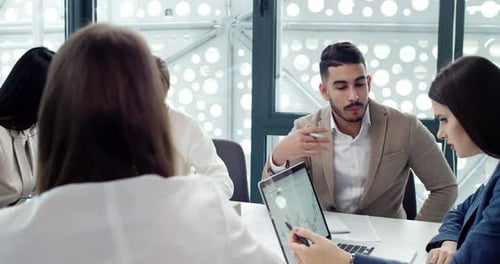 Brainstorm of Beautiful Professional Workers of Modern Company Office Analyzing and Planning Work