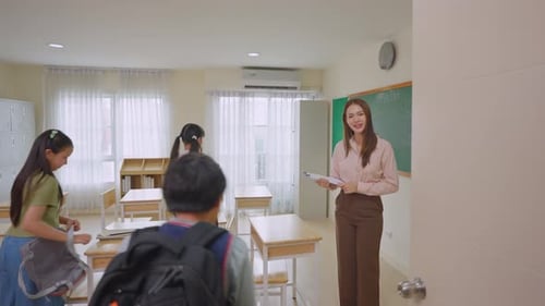 Back to school of adorable student entering classroom at elementary school.