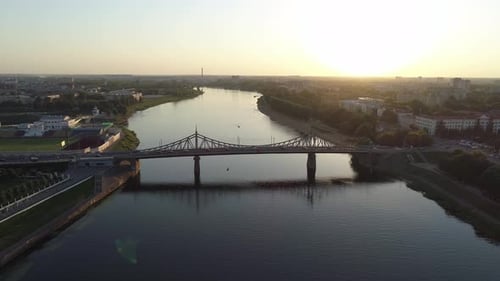 Aerial View of the Road Bridge Across the River at Sunset Beautiful Cityscape