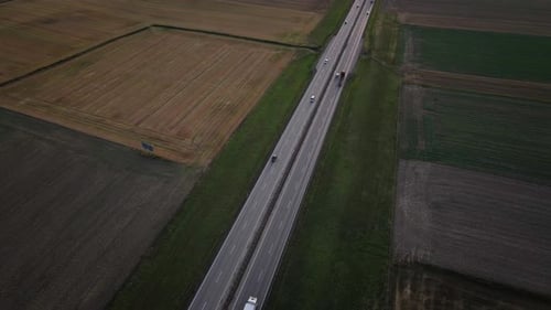 Aerial View of Highway Road with Car Traffic in Countryside