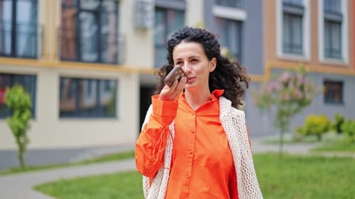 Woman Records Voice Message Outdoors
