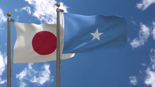 Japan and Somalia National Flags Waving on Flagpoles