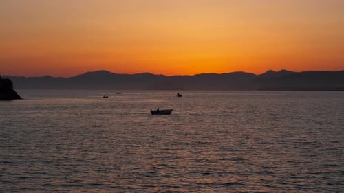 Dramatic Dusk Over Yacht Silhouette