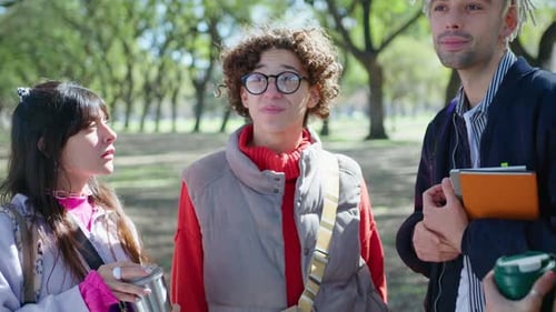College Friends Standing in the Park and Discussing Study