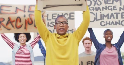 Group of People Protesting and Marching in the Streets