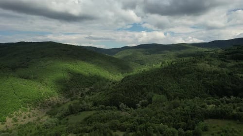 Aerial Woodland, view of cloudy and mountainous areas from the height, nature landscape drone view,