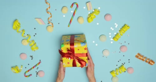 Gift Box Placed Among Festive Decorations