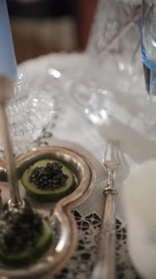 Caviar on Cucumber Slices in Silver Serving Dish